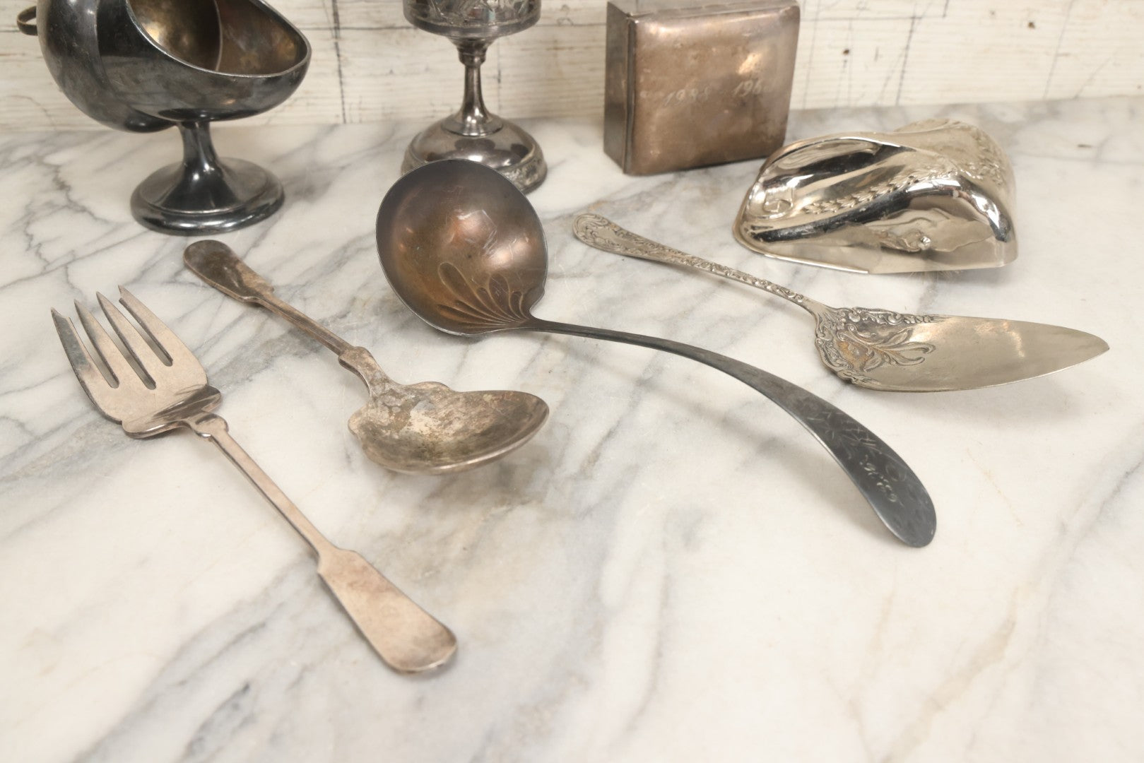 Lot 069 - Eight-Piece Vintage Silverplate Tableware And Accessories Lot Including Engraved Chalice, “The Crumber” Table Sweeper, Sugar Scuttle, Utensils, And 1938-1963 25th Anniversary Presentation Box