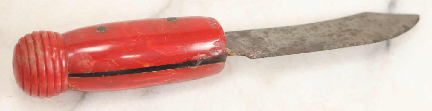 Lot 071 - Grouping Of Vintage Red And Yellow Bakelite And Plastic Game Pieces, Knobs, Shifter Knob, Knife, And More, As Found