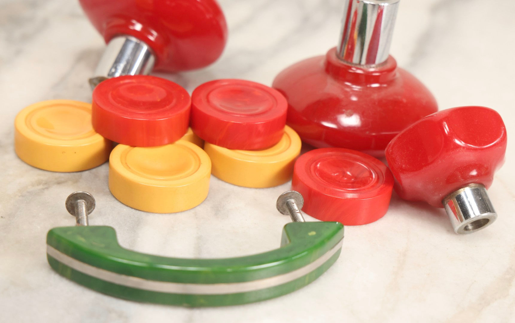 Lot 071 - Grouping Of Vintage Red And Yellow Bakelite And Plastic Game Pieces, Knobs, Shifter Knob, Knife, And More, As Found