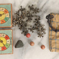 Lot 072 - Grouping Of Vintage Children's Small Games And Toys With Drawstring Sack, Jacks, Clay Marbles, And Two Wood Block Multi-Function Spinners With Paper Dials