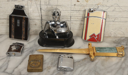 Lot 075 - Grouping Of Seven Vintage Lighters For Parts Or Repair, Including Knight Armor Table Lighter, Ronson Case Lighters, Camel Zippo, And Novelty Examples