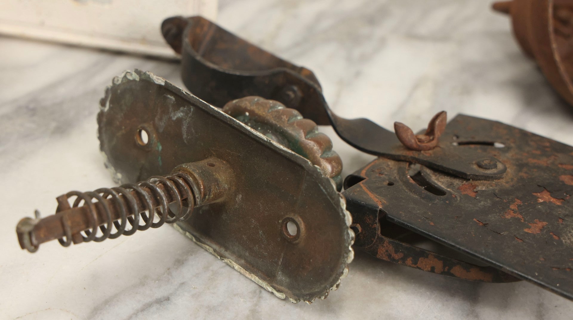 Lot 077 - Grouping Of Four Antique Hardware Items Including Metal Bell, Door Knobs, Escutcheon, And Autodesk Steering Wheel Bracket