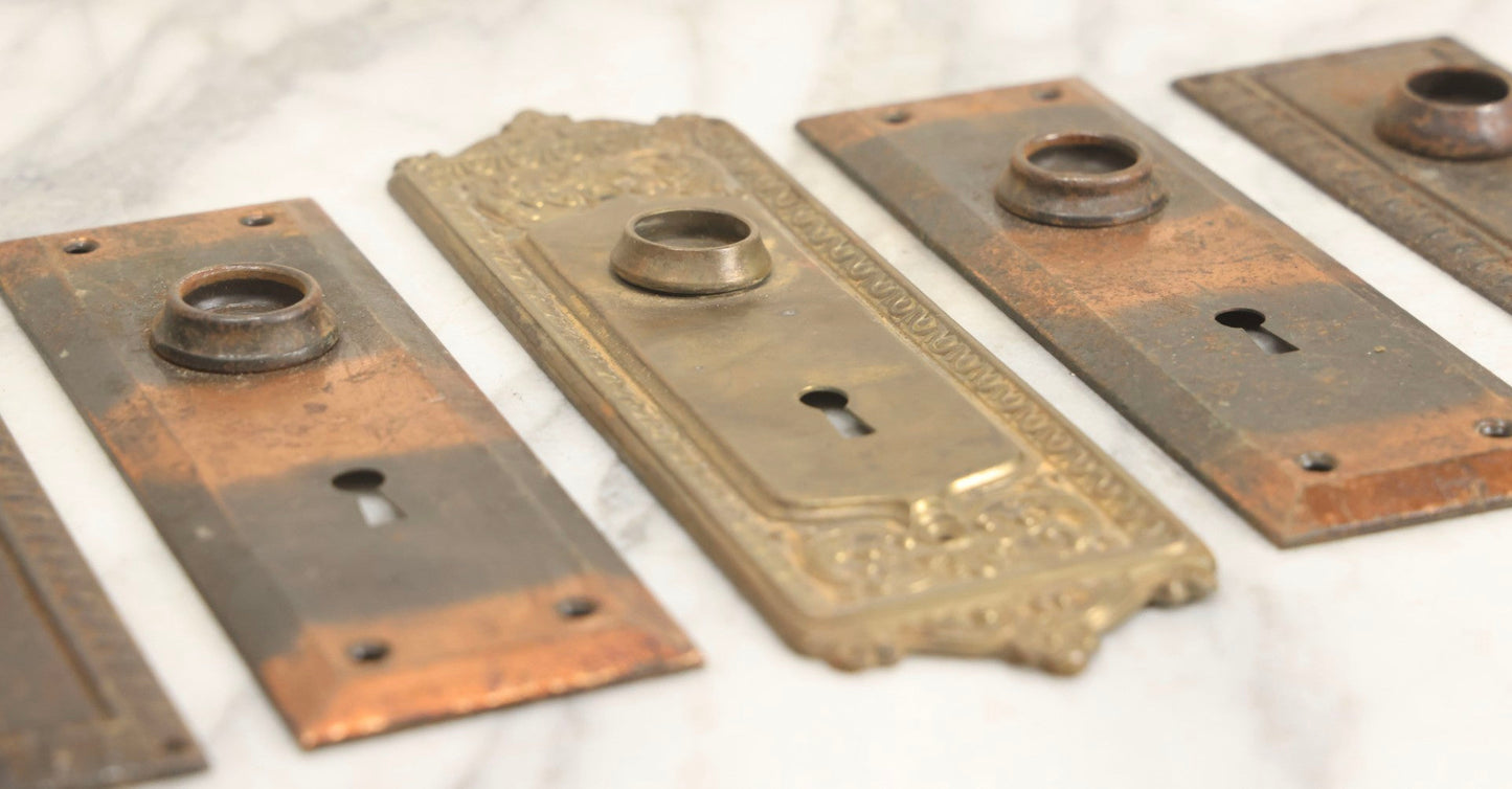 Lot 079 - Antique Door Hardware Grouping With Two Pairs Of Sheet Metal Escutcheons And One Pressed Brass Escutcheon