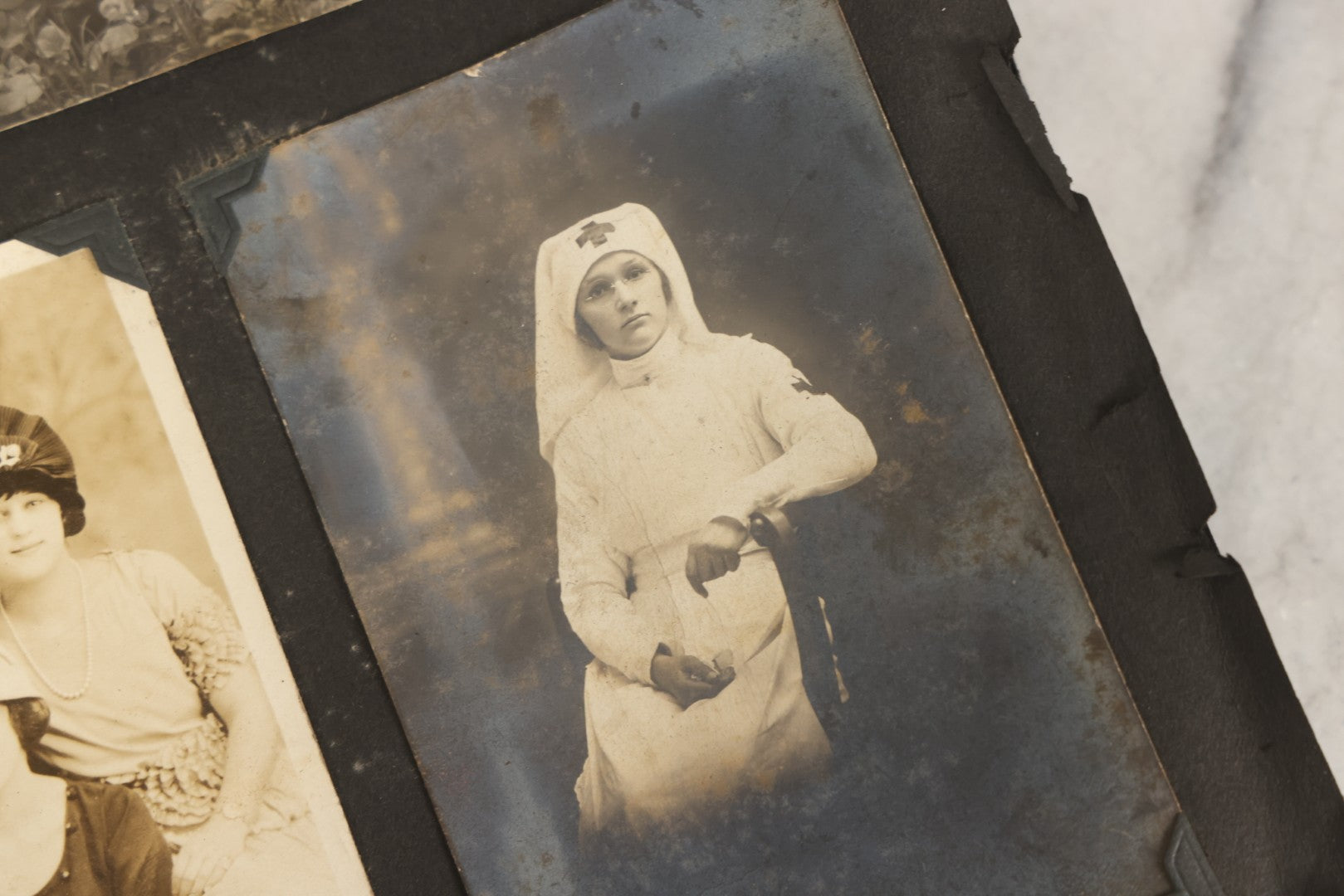 Lot 083 - Vintage Photo Album With Snapshot Photographs From 1920s To 1940s 130+ Photos Including Antique Nurse Real Photo Postcard, WWII Serviceman's Military Service And Family Life, Musicians, Trip To Nyc With Statue Of Liberty