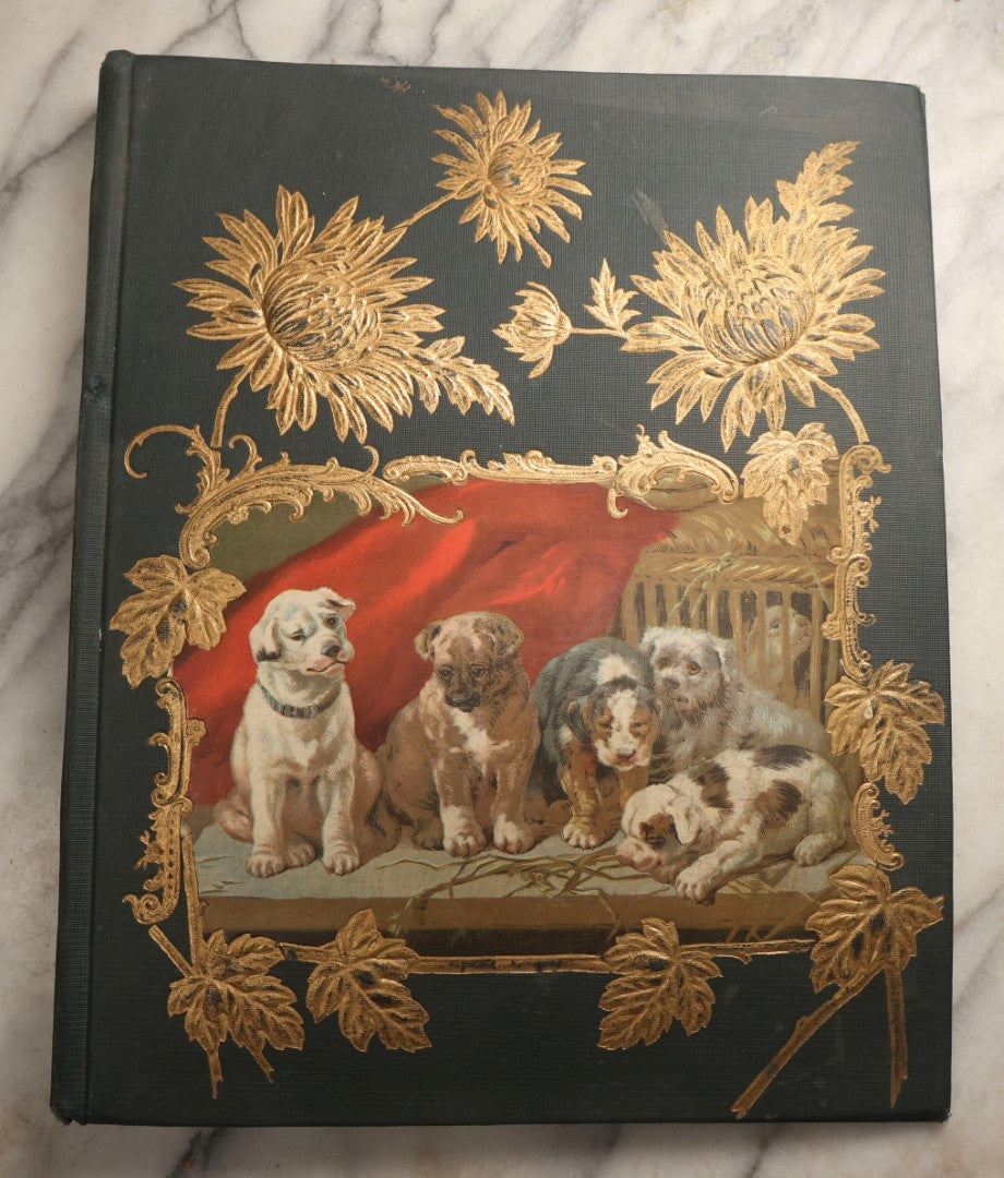 Lot 096 - Antique "The Nonpareil" Scrapbook, Puppies Illustration On Cover, With 100+ Trade Cards, Die Cuts, And Greeting Cards Featuring Children, Butterflies, And Flowers, Circa 1900-1906, Note Binding Detached