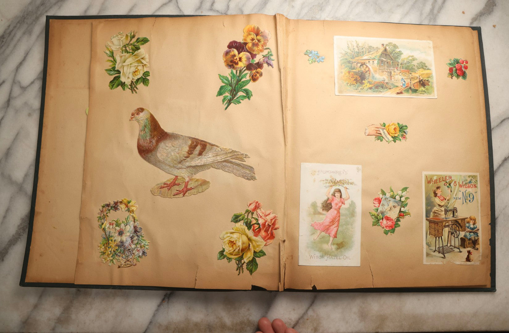 Lot 096 - Antique "The Nonpareil" Scrapbook, Puppies Illustration On Cover, With 100+ Trade Cards, Die Cuts, And Greeting Cards Featuring Children, Butterflies, And Flowers, Circa 1900-1906, Note Binding Detached