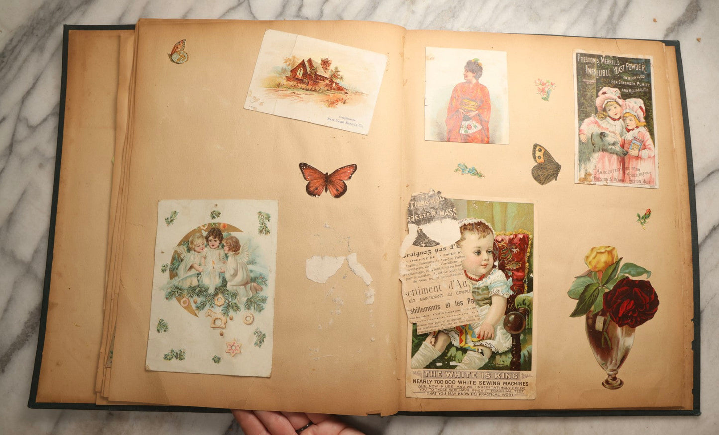 Lot 096 - Antique "The Nonpareil" Scrapbook, Puppies Illustration On Cover, With 100+ Trade Cards, Die Cuts, And Greeting Cards Featuring Children, Butterflies, And Flowers, Circa 1900-1906, Note Binding Detached