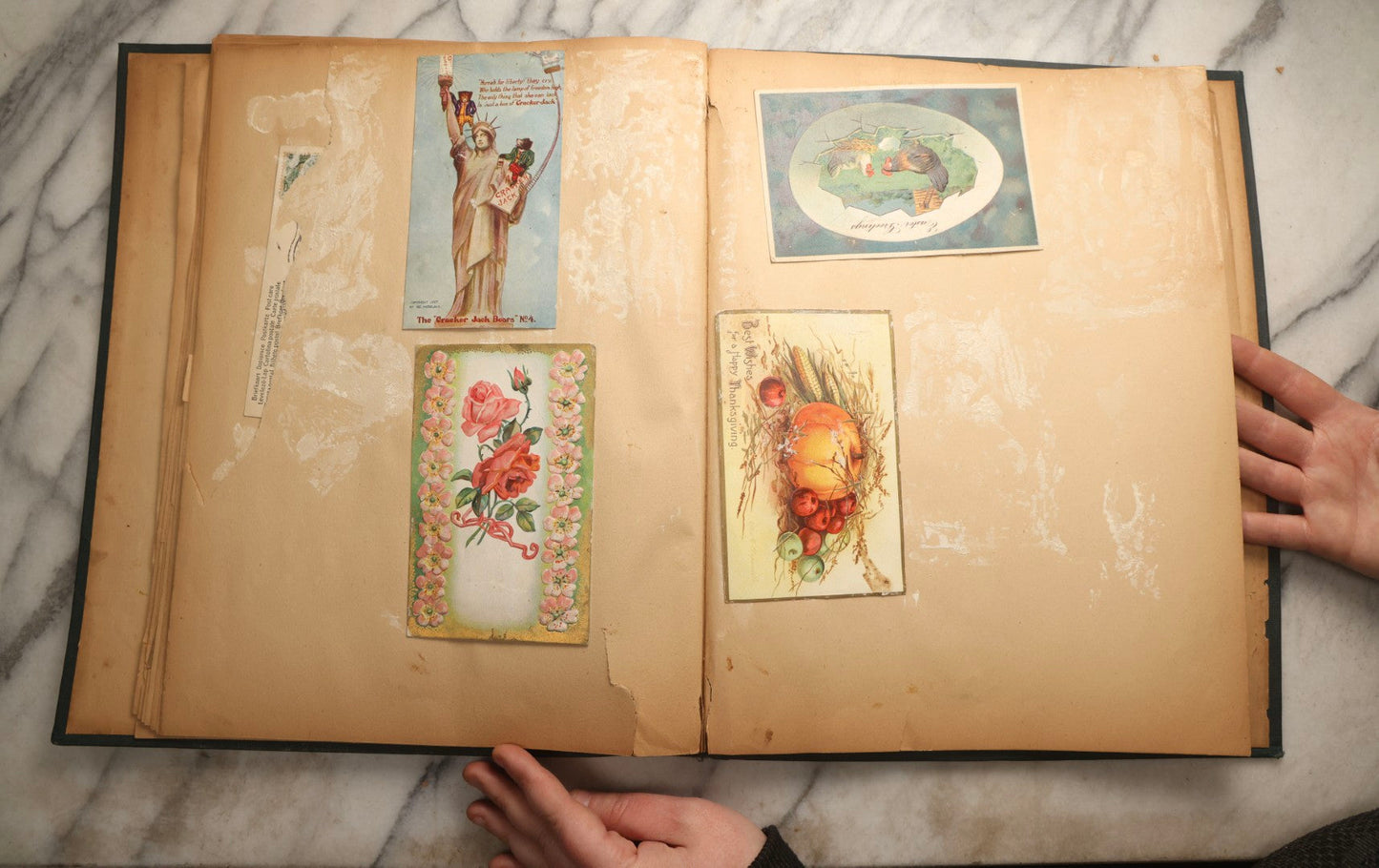 Lot 096 - Antique "The Nonpareil" Scrapbook, Puppies Illustration On Cover, With 100+ Trade Cards, Die Cuts, And Greeting Cards Featuring Children, Butterflies, And Flowers, Circa 1900-1906, Note Binding Detached