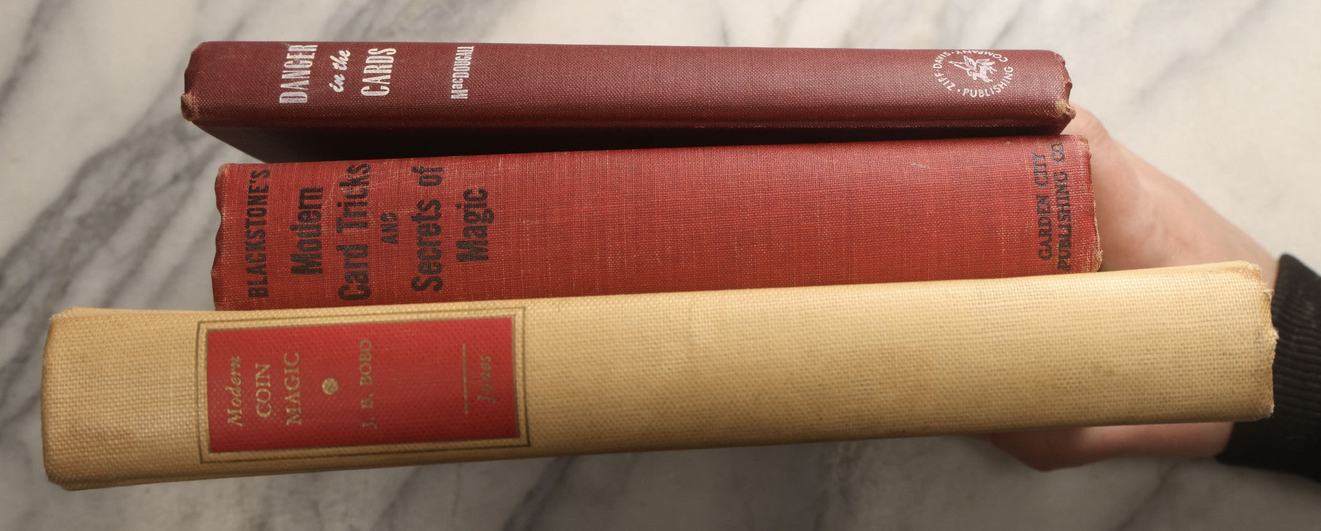 Lot 104 - Grouping Of Three Vintage Magic Books Including "Danger In The Cards" By Michael Macdougall, "Modern Coin Magic" By J.B. Bobo, And "Blackstone's Modern Card Tricks And Secrets Of Magic" By Harry Blackstone