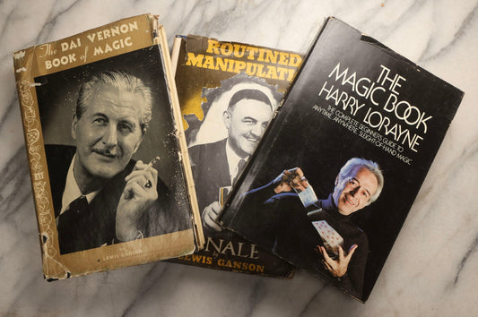 Lot 105 - Grouping Of Three Vintage Magic Books With Dust Jackets Including "The Magic Book" By Harry Lorayne, "The Dai Vernon Book Of Magic" By Lewis Ganson, And "Routined Manipulation Finale" By Lewis Ganson, Circa 1960s-1970s