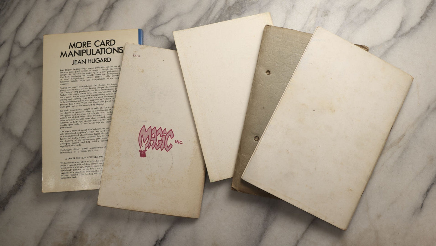 Lot 107 - Grouping Of Five Vintage Magic Paperbacks And Booklets Including "The Close-Up Magician," "Stand Up Close," "French's Manipulative Magic With Additions," "More Card Manipulations" By Jean Hugard, And "Paul Rosini Magical Gems: A Memorial"