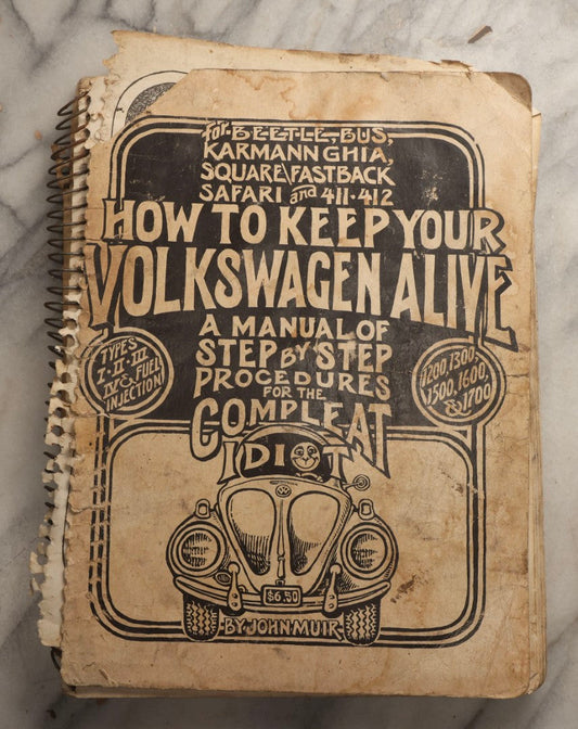 Lot 111 - Vintage Illustrated Automotive Shop Manual "How To Keep Your Volkswagen Alive: A Manual Of Step-By-Step Procedures For The Complete Idiot" By John Muir, Illustrated By Peter Aschwanden, 1975 Edition, Santa Fe, New Mexico