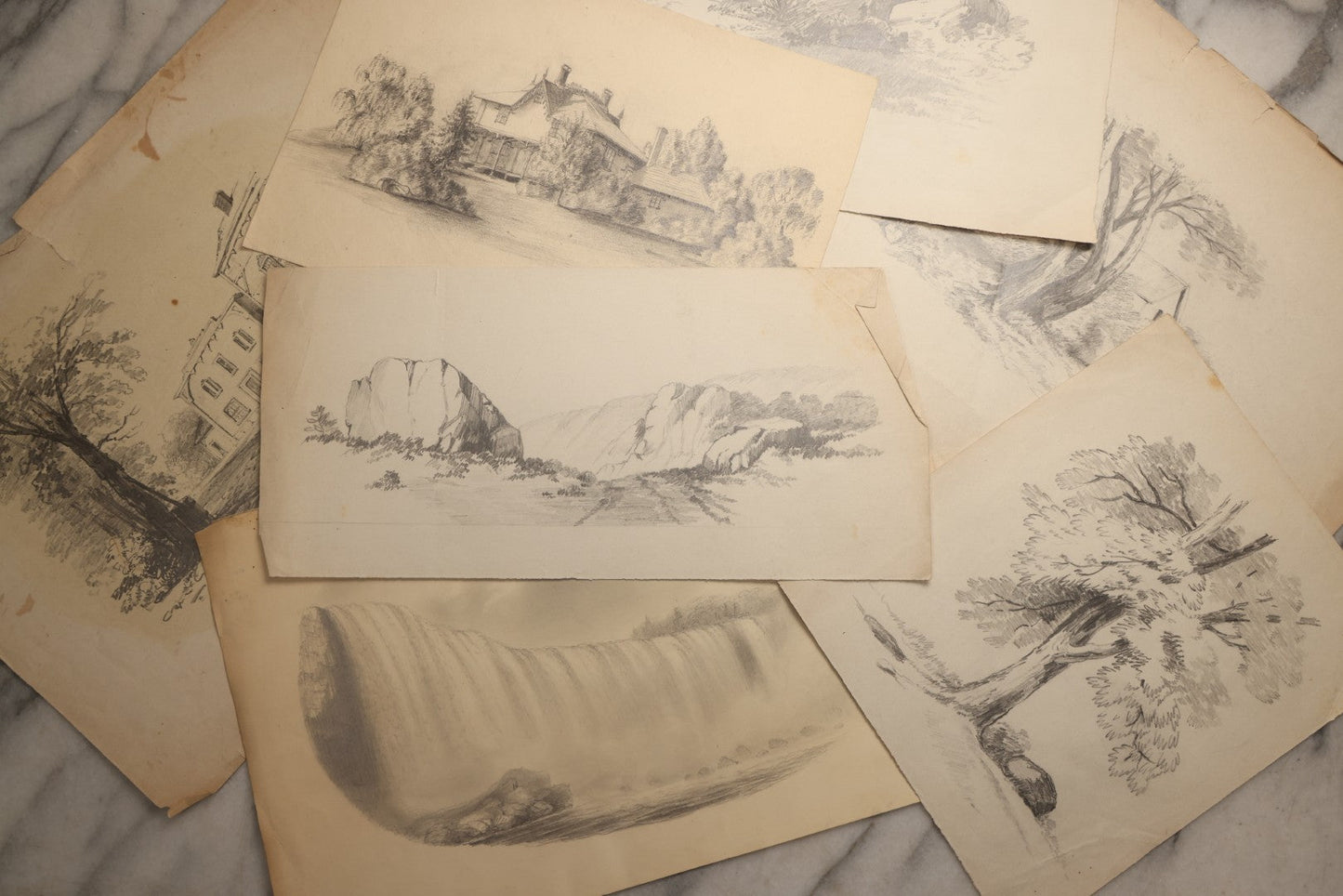 Lot 115 - Grouping Of Eight Antique Hand-Drawn Pencil Landscape Sketches Including Niagara Falls, Rocky Pastures, And American Domestic Exterior Scenes, With One Dated 1852 Depicting A Large American House