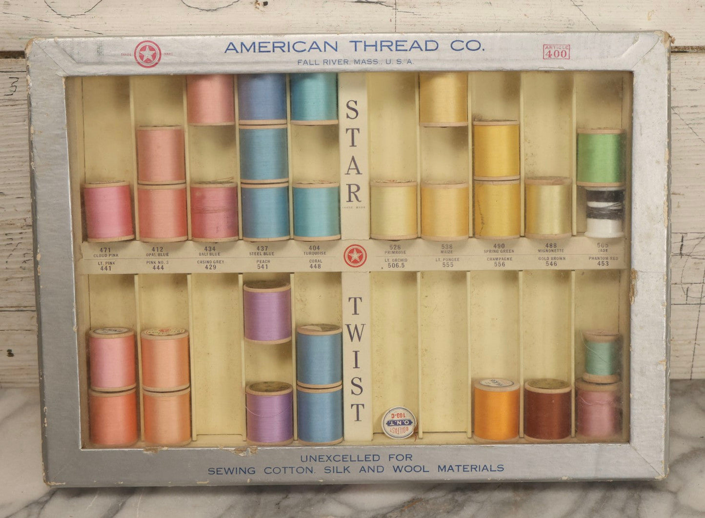 Lot 116 - Antique Star Twist Silver Thread Display Case With Hinged Lid, Pastel Colored Cotton Thread On Wooden Spools, And Ribbon Supports, American Thread Co., Fall River, Massachusetts