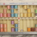 Lot 116 - Antique Star Twist Silver Thread Display Case With Hinged Lid, Pastel Colored Cotton Thread On Wooden Spools, And Ribbon Supports, American Thread Co., Fall River, Massachusetts