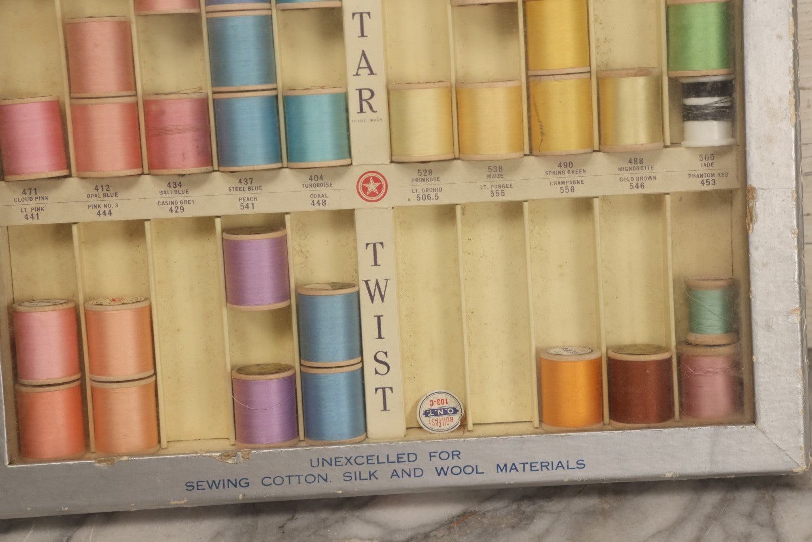 Lot 116 - Antique Star Twist Silver Thread Display Case With Hinged Lid, Pastel Colored Cotton Thread On Wooden Spools, And Ribbon Supports, American Thread Co., Fall River, Massachusetts