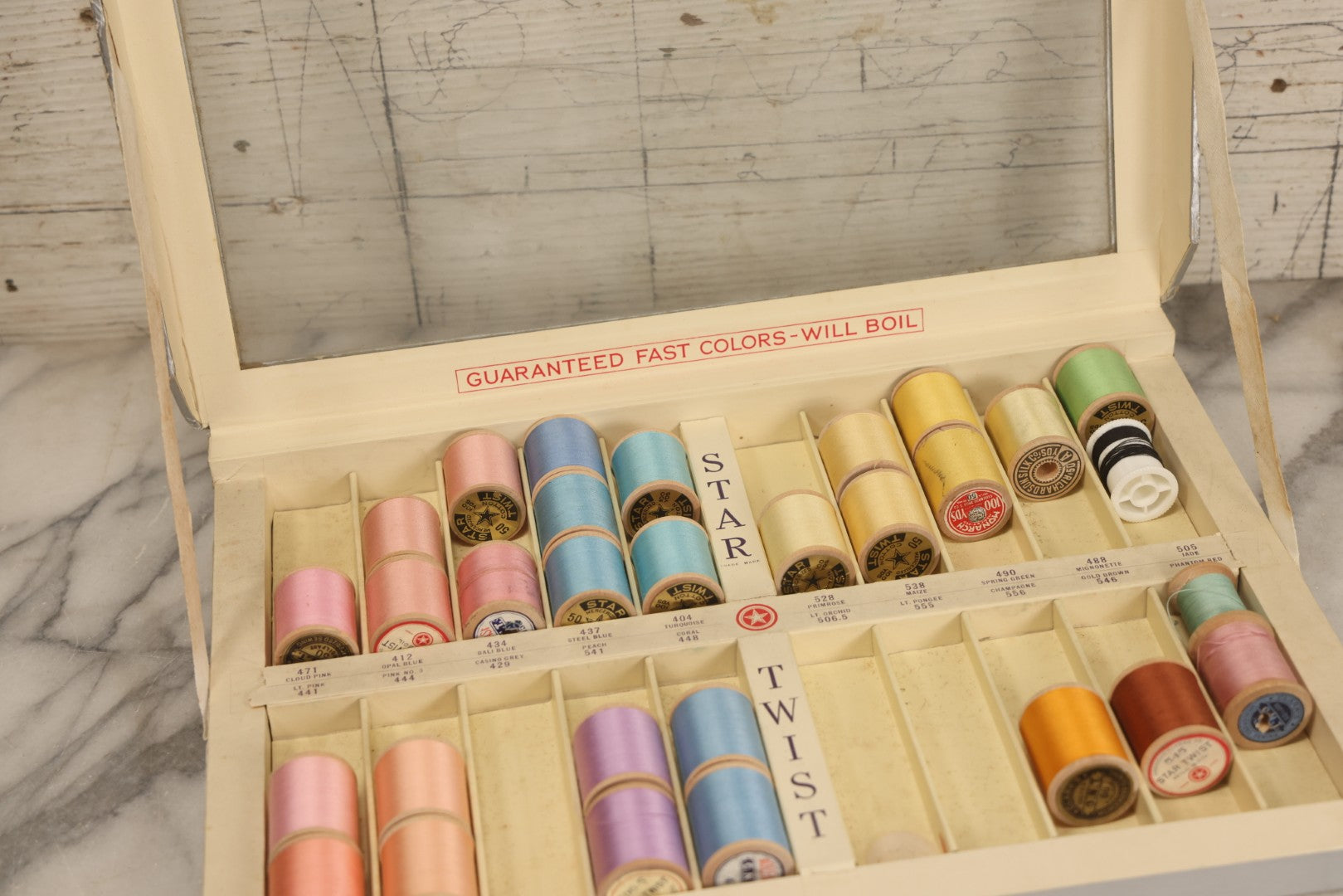 Lot 116 - Antique Star Twist Silver Thread Display Case With Hinged Lid, Pastel Colored Cotton Thread On Wooden Spools, And Ribbon Supports, American Thread Co., Fall River, Massachusetts