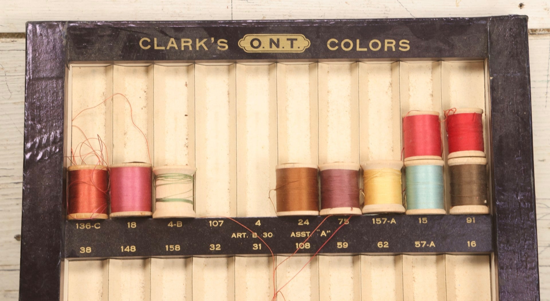 Lot 117 - Antique Clark's O.N.T. Colors Boilfast Sewing Thread Display Case With Wooden Spools, Open Top