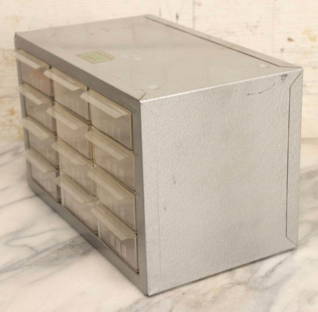 Lot 123 - Vintage A-M Cabinets Silver Metal 21-Drawer Parts Organizer With Original Paper Advertising And Labeling Supplies, Manufactured By Akro-Mils, Akron, Ohio