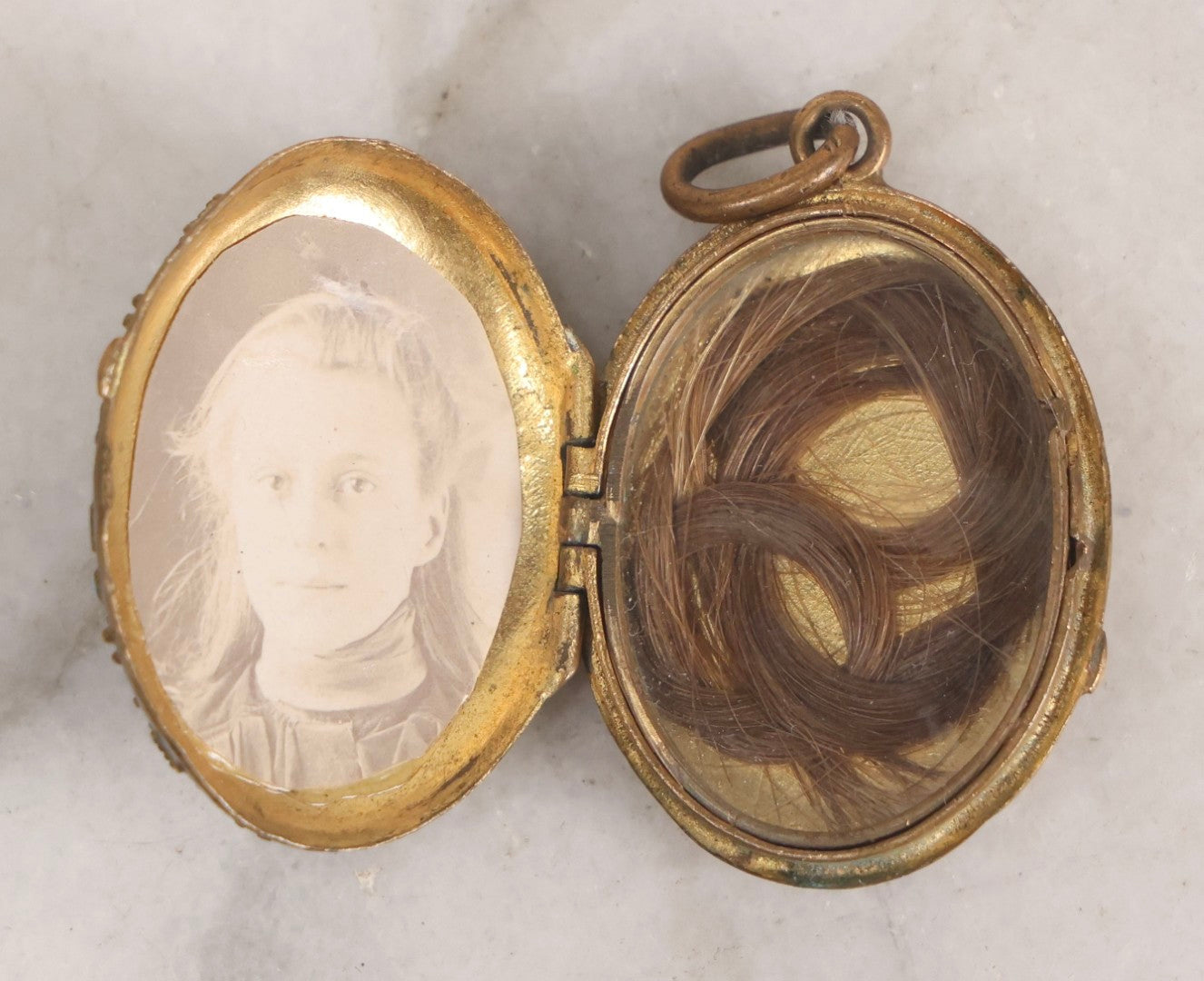 Lot 015 - Antique Victorian Gilt Metal Hair Locket With Turquoise Glass Cabochons, Portrait Photograph And Hair Keepsake, In Taylor's Diamonds Box