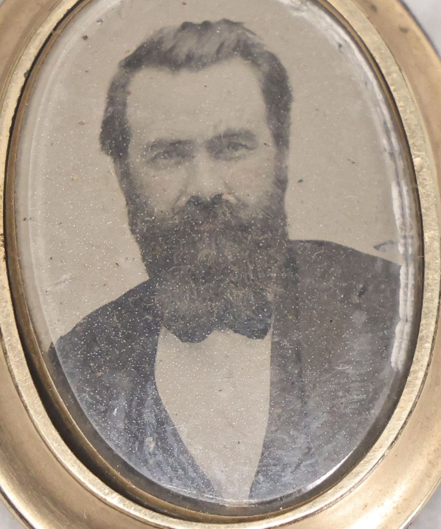 Lot 016 - Antique Tintype Portrait Brooch In Oval Metal Mount With Photo Of Bearded Gentleman