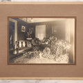 Lot 018 - Antique Board-Mounted Photograph Depicting Funeral Of Charles D. Brown, Died March 29, 1921, Home Parlor Setting With Casket And Floral Arrangements
