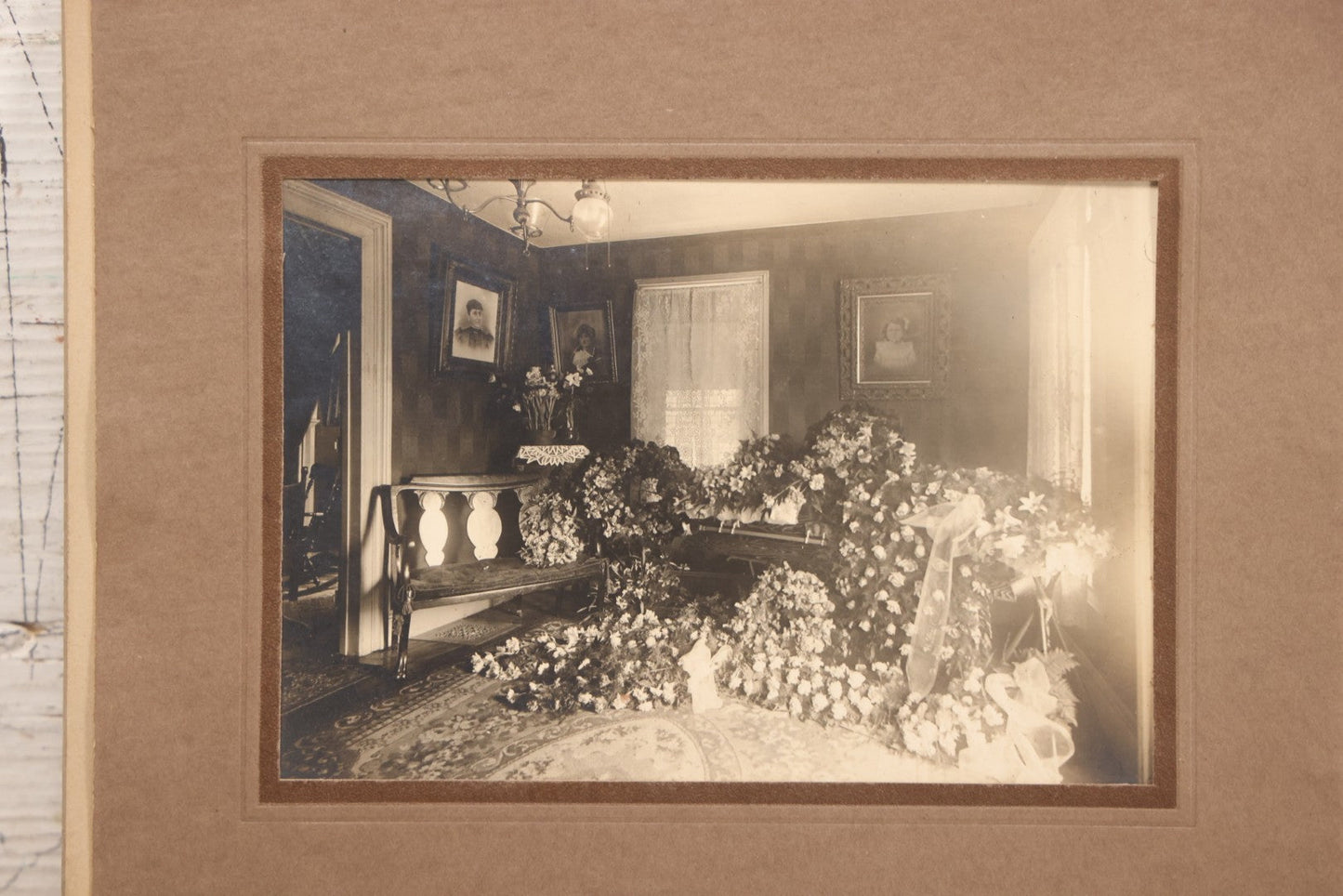 Lot 018 - Antique Board-Mounted Photograph Depicting Funeral Of Charles D. Brown, Died March 29, 1921, Home Parlor Setting With Casket And Floral Arrangements