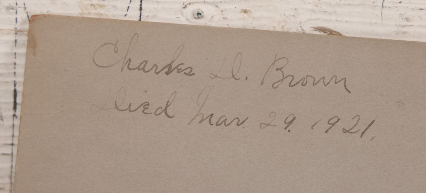 Lot 018 - Antique Board-Mounted Photograph Depicting Funeral Of Charles D. Brown, Died March 29, 1921, Home Parlor Setting With Casket And Floral Arrangements