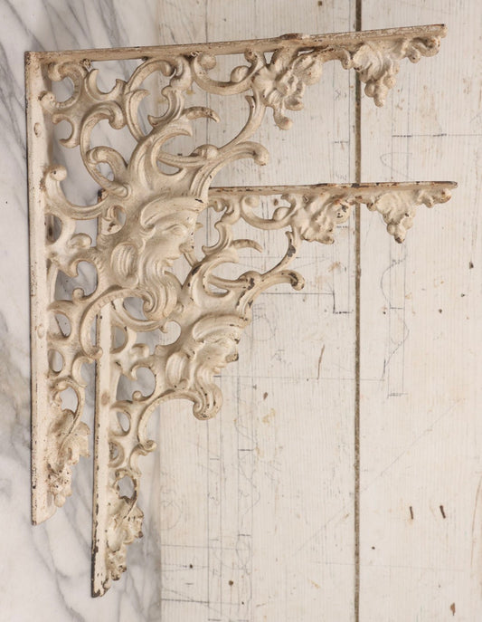 Lot 028 - Pair Of Antique White Painted Cast Iron Ornate Architectural Shelf Brackets With Figural Face Motif