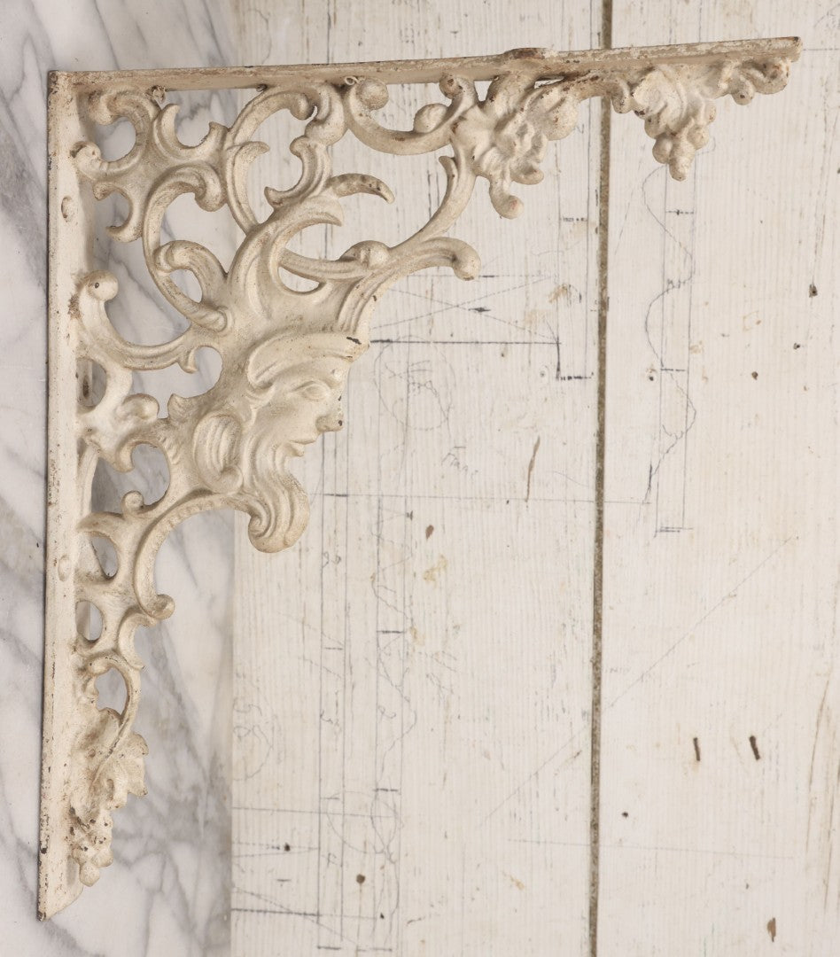 Lot 028 - Pair Of Antique White Painted Cast Iron Ornate Architectural Shelf Brackets With Figural Face Motif