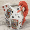 Lot 032 - Vintage Royal Bayreuth "Devil & Cards" Pitcher With Playing Card Motif And Devil Handle, Circa 1940s Marked "Bermuda", Note Chip To Spout, 7-1/2" H