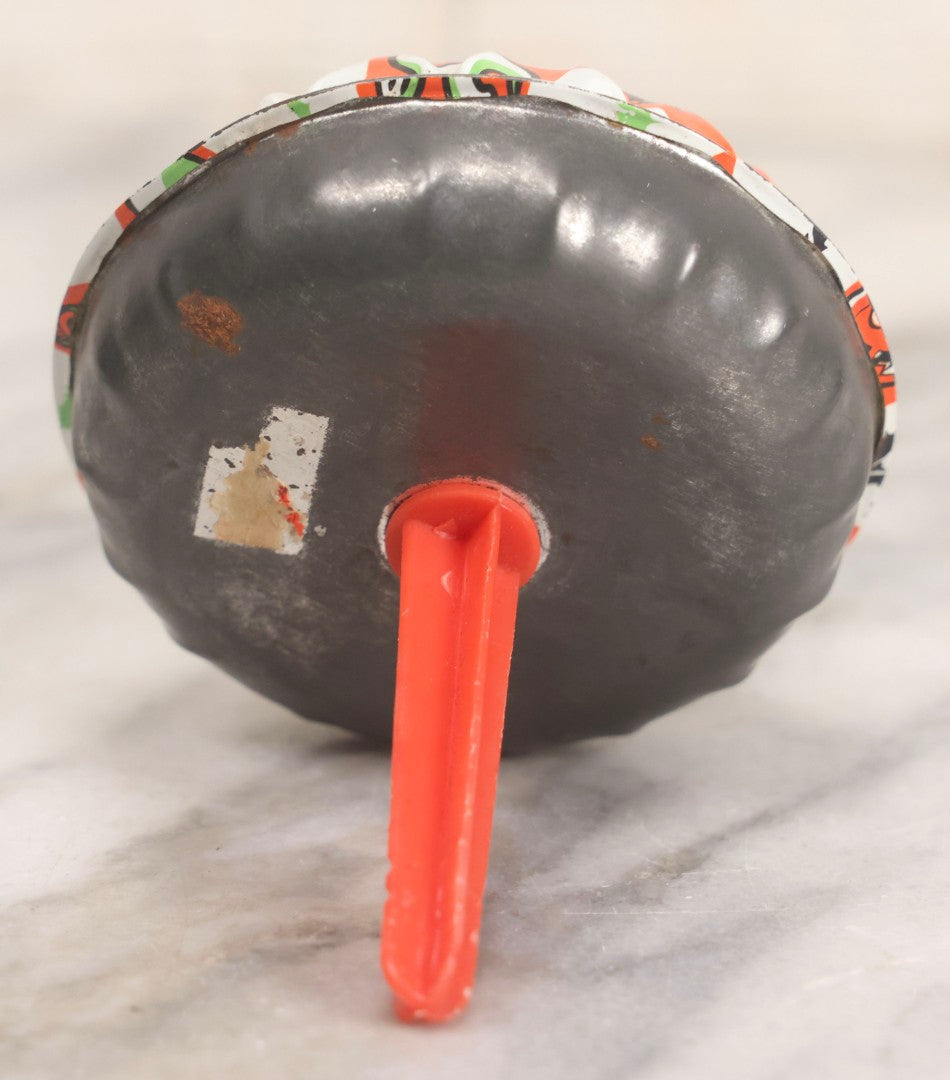 Lot 048 - Vintage Round Halloween Tin Lithograph Noisemaker With Orange And White Checkered Pattern Featuring Black Cat, Witch, Ghost, Bat, Skull, And Jack-O'-Lantern J.O.L. Characters