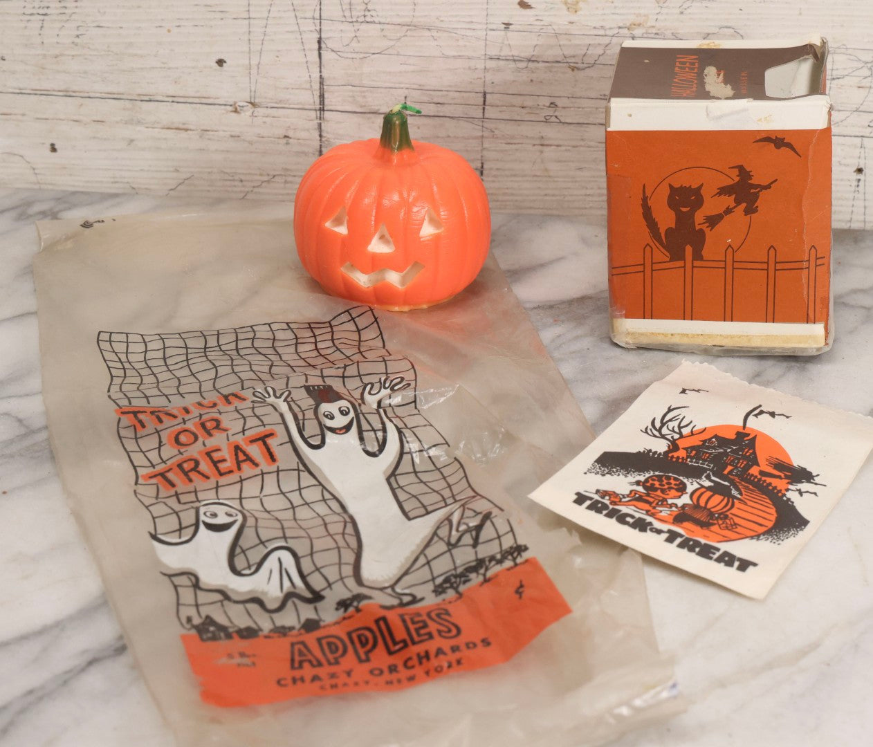 Lot 050 - Trio Of Vintage Halloween Items Including Gurley Jack O' Lantern Candle In Box, Trick-Or-Treat Bag, And Chazy Orchards Ghost Apple Bag