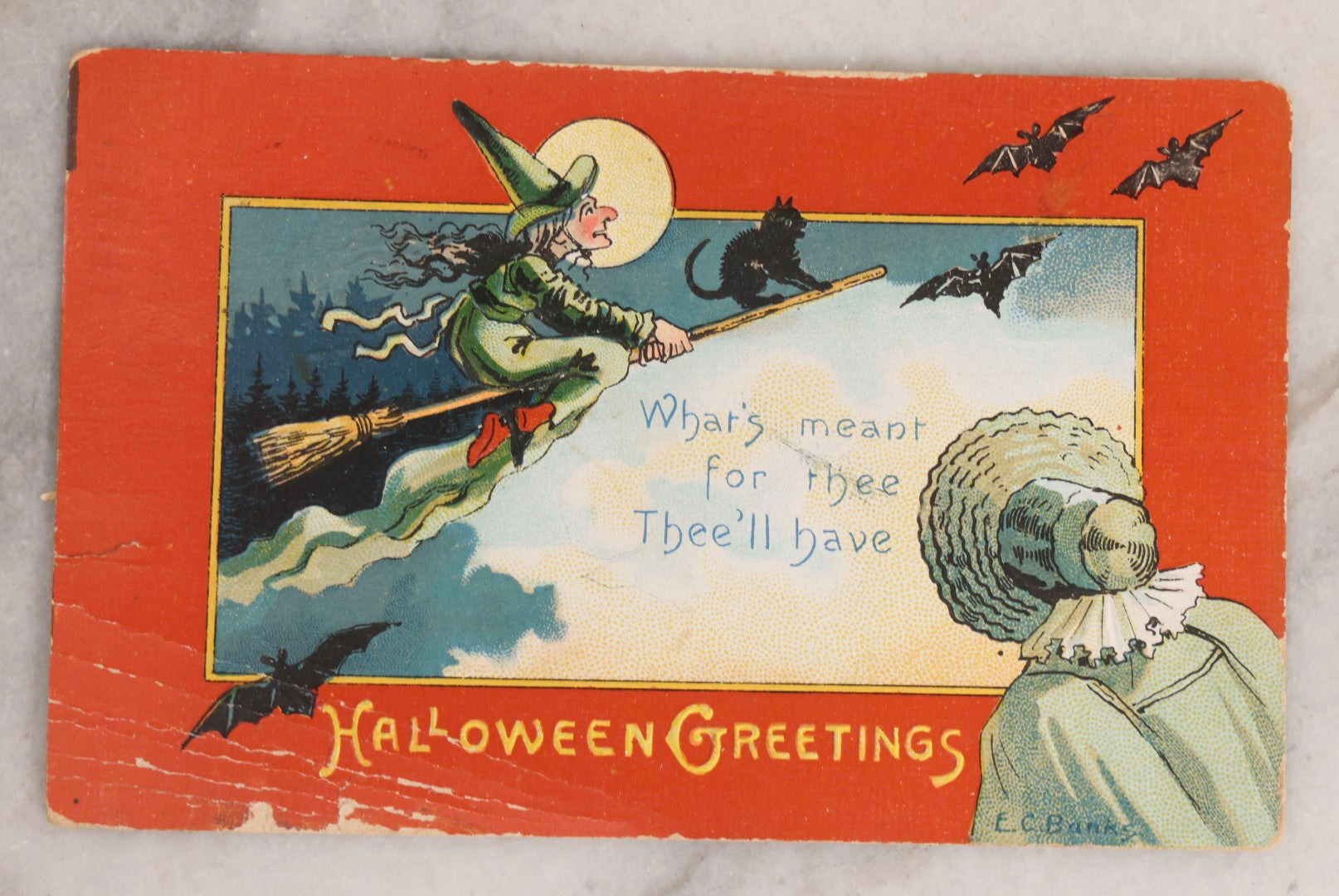 Lot 051 - Antique Embossed Halloween Postcard Featuring Witch On Broomstick With Black Cat, Moon, And Woman In Bonnet, Orange Border, Illustrated By E.C. Banks, Made In Saxony, Postmarked 1909