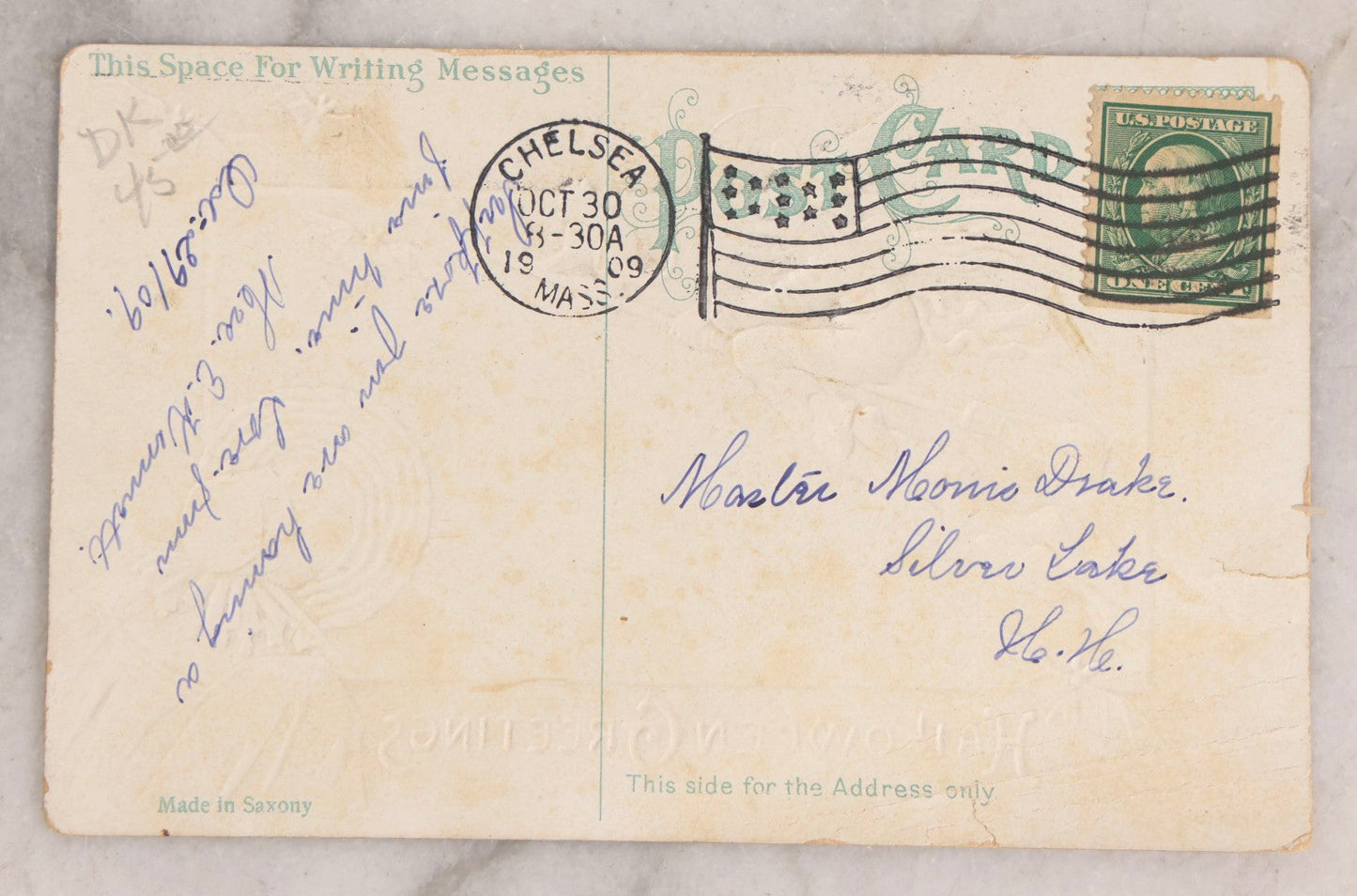 Lot 051 - Antique Embossed Halloween Postcard Featuring Witch On Broomstick With Black Cat, Moon, And Woman In Bonnet, Orange Border, Illustrated By E.C. Banks, Made In Saxony, Postmarked 1909