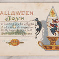 Lot 052 - Antique Embossed Halloween Postcard Featuring Witch On Candle With Black Cat, Jack-O-Lantern J.O.L. Smoking A Pipe, Faces In The Candlestand And Candle Wax, And Witch's Shadow, Made In U.S.A.., Postmarked October 31, 1914