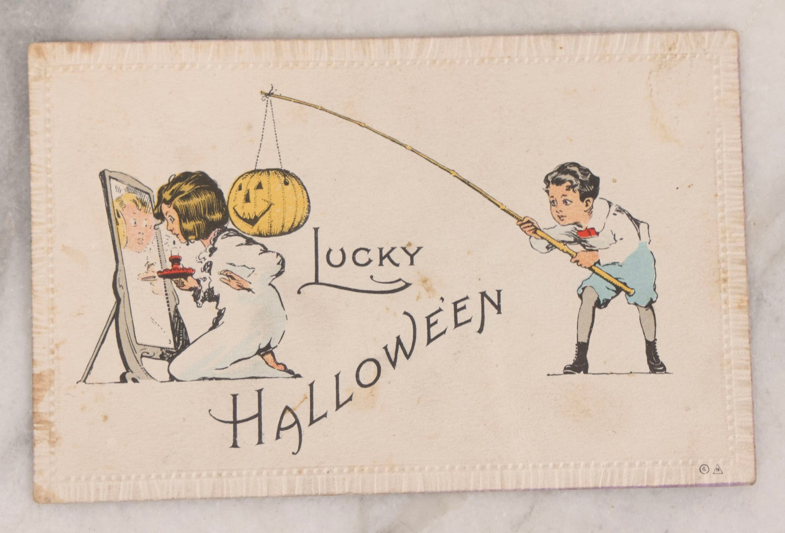 Lot 055 - Antique Halloween Postcard, "Lucky Halloween", Boy With Jack-O-Lantern J.O.L. On Fishing Pole And Girl With Mirror, Halloween Series No. 8-A