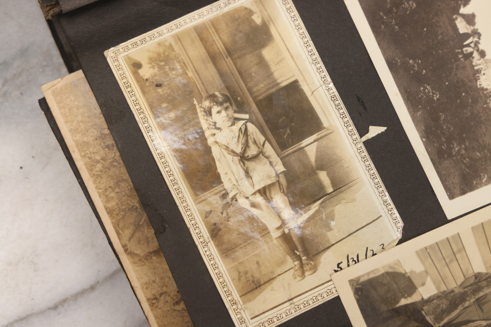Lot 069 - Antique Snapshot Photograph Album With 100+ Images Circa 1920-1930 Including Beach Scenes In Period Swimwear, Cats And Kittens, Young Boy With American Flag, And Mechanic Working On Early Automobile