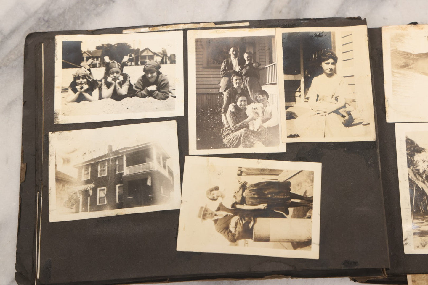 Lot 069 - Antique Snapshot Photograph Album With 100+ Images Circa 1920-1930 Including Beach Scenes In Period Swimwear, Cats And Kittens, Young Boy With American Flag, And Mechanic Working On Early Automobile