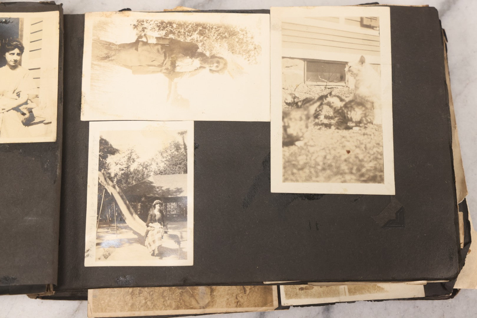 Lot 069 - Antique Snapshot Photograph Album With 100+ Images Circa 1920-1930 Including Beach Scenes In Period Swimwear, Cats And Kittens, Young Boy With American Flag, And Mechanic Working On Early Automobile