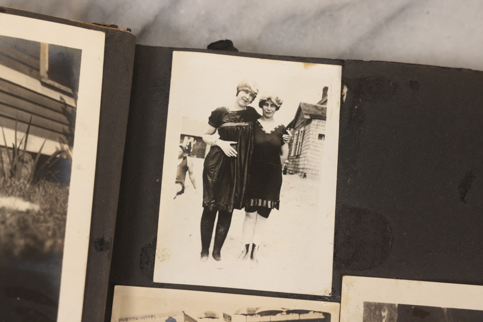 Lot 069 - Antique Snapshot Photograph Album With 100+ Images Circa 1920-1930 Including Beach Scenes In Period Swimwear, Cats And Kittens, Young Boy With American Flag, And Mechanic Working On Early Automobile