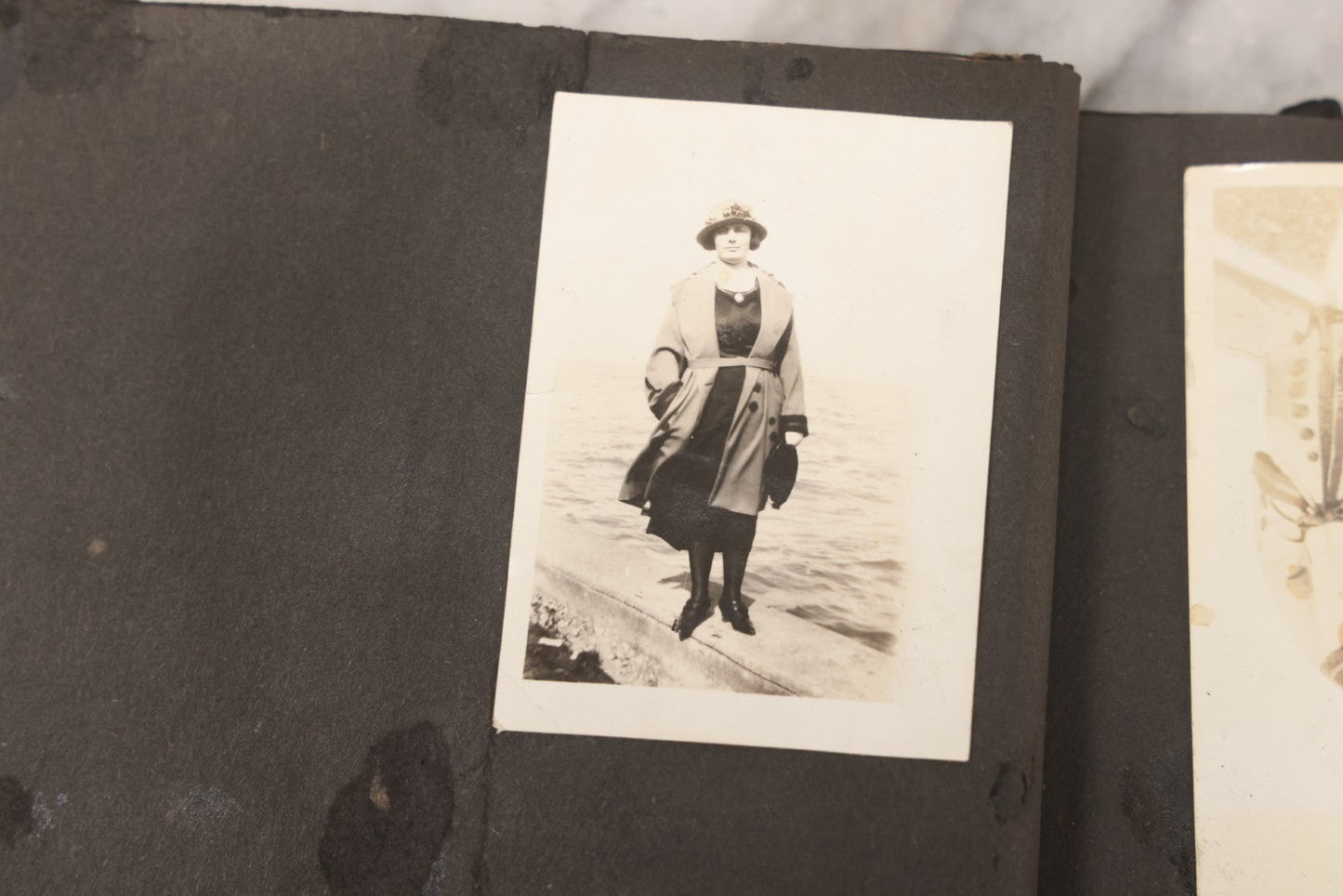 Lot 069 - Antique Snapshot Photograph Album With 100+ Images Circa 1920-1930 Including Beach Scenes In Period Swimwear, Cats And Kittens, Young Boy With American Flag, And Mechanic Working On Early Automobile
