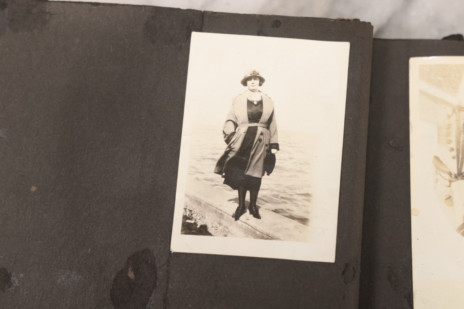 Lot 069 - Antique Snapshot Photograph Album With 100+ Images Circa 1920-1930 Including Beach Scenes In Period Swimwear, Cats And Kittens, Young Boy With American Flag, And Mechanic Working On Early Automobile
