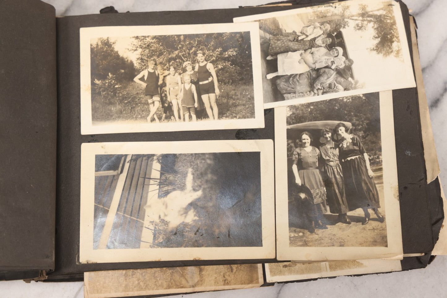Lot 069 - Antique Snapshot Photograph Album With 100+ Images Circa 1920-1930 Including Beach Scenes In Period Swimwear, Cats And Kittens, Young Boy With American Flag, And Mechanic Working On Early Automobile
