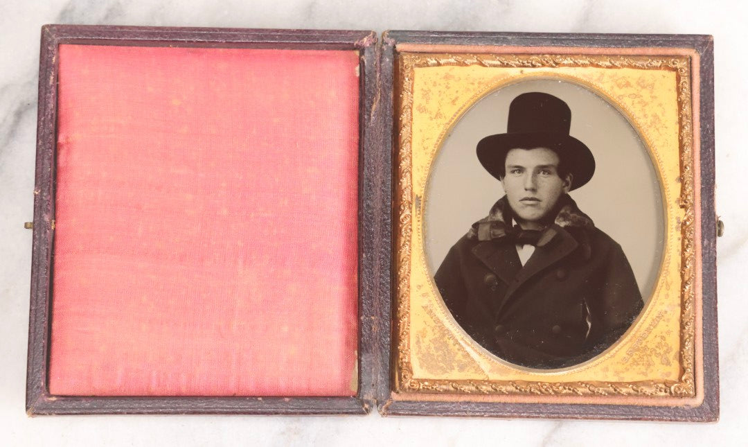 Lot 071 - Antique 1/6th Plate Ambrotype Photograph Of Young Man With Freckles Wearing Top Hat, In Full Leatherette Case, Photographed By S. F. Sterlin, Vermont