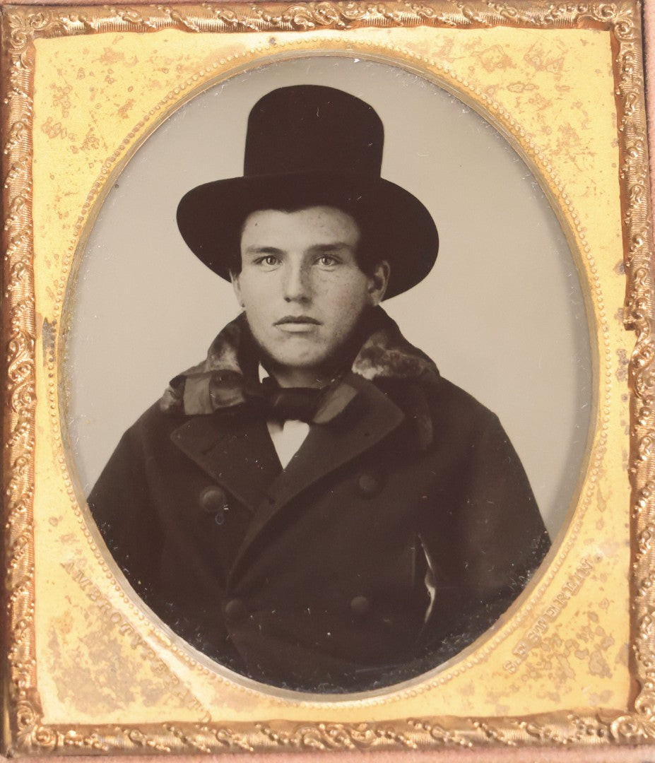 Lot 071 - Antique 1/6th Plate Ambrotype Photograph Of Young Man With Freckles Wearing Top Hat, In Full Leatherette Case, Photographed By S. F. Sterlin, Vermont