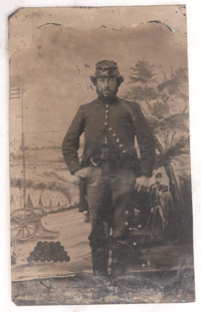 Lot 076 - Antique Civil War–Era Uncased Tintype Photograph Of Union Soldier, Full-Length Standing Portrait With Painted Military Backdrop, Circa 1860s