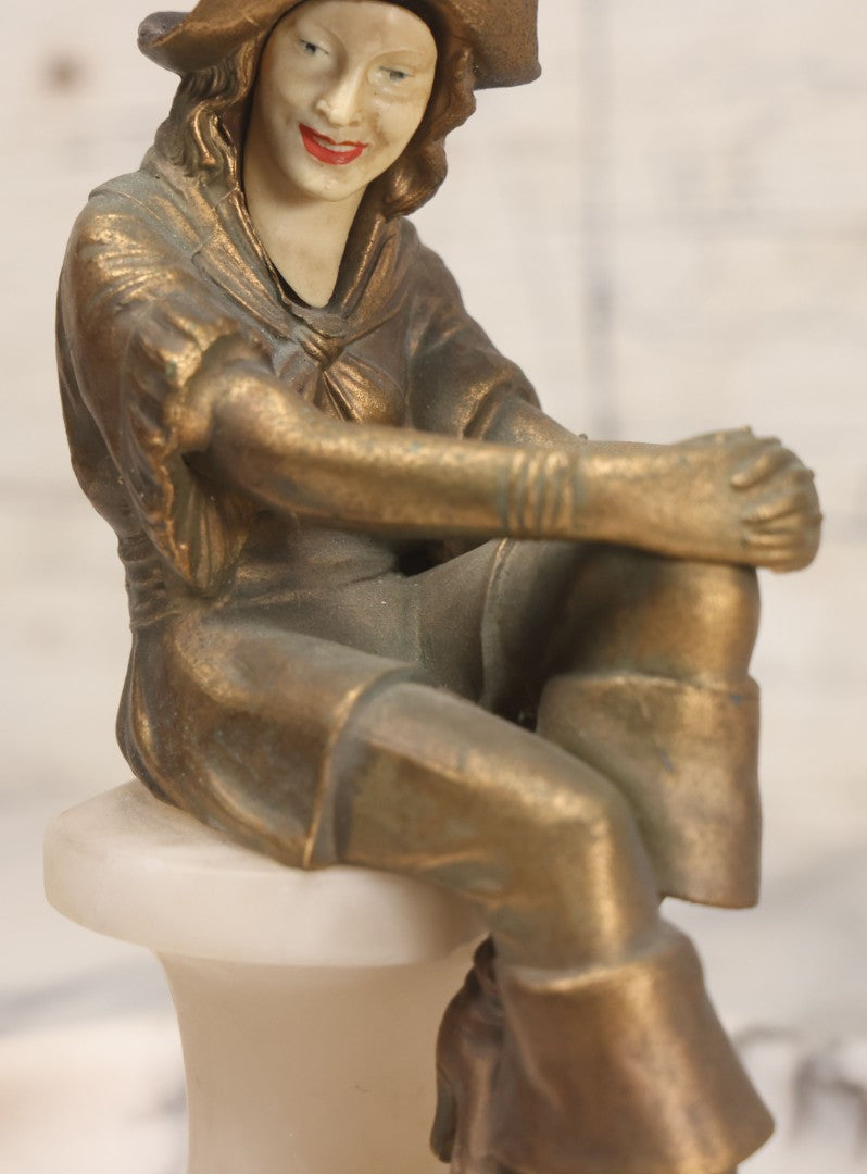 Lot 082 - Antique Alabaster Ashtray With Metal Female Pirate Figure Seated On Pedestal, Note Loss To Pedestal Base, Loosening Bolt