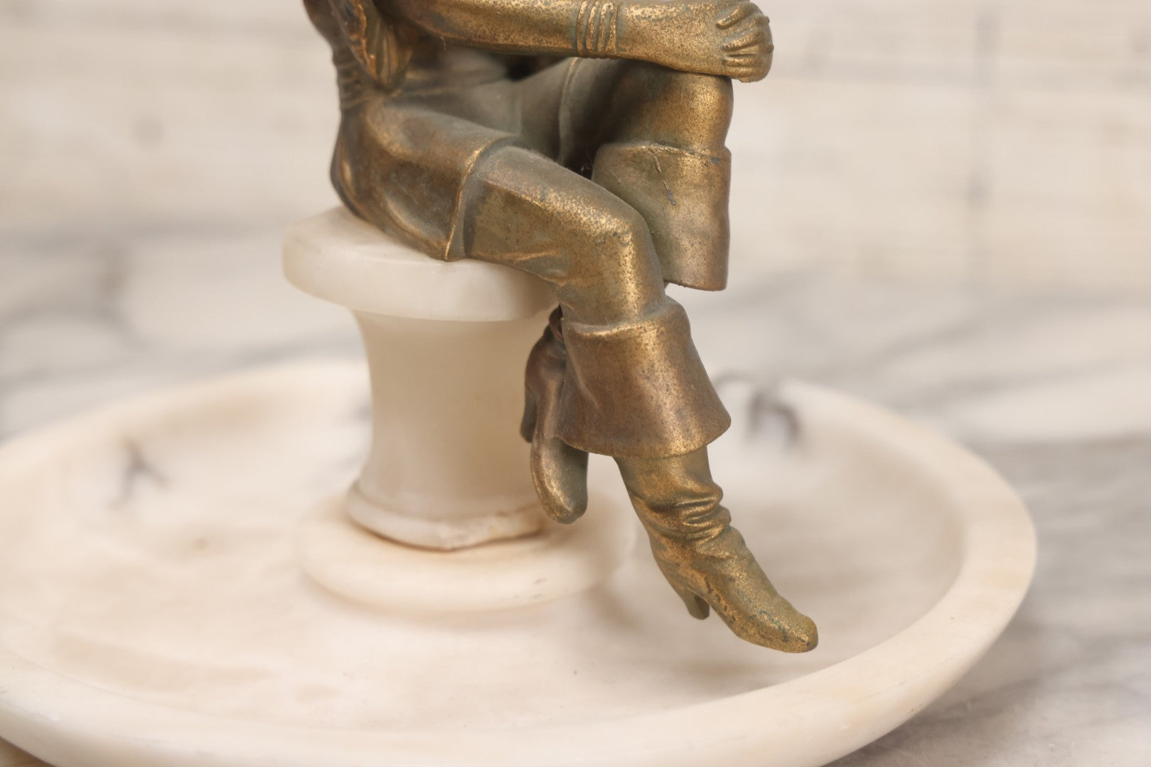 Lot 082 - Antique Alabaster Ashtray With Metal Female Pirate Figure Seated On Pedestal, Note Loss To Pedestal Base, Loosening Bolt