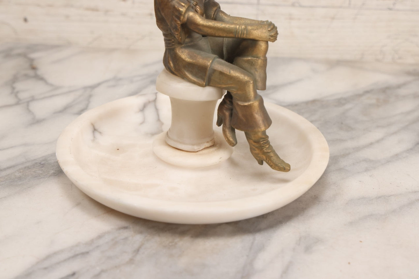 Lot 082 - Antique Alabaster Ashtray With Metal Female Pirate Figure Seated On Pedestal, Note Loss To Pedestal Base, Loosening Bolt